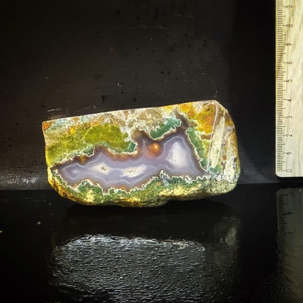 Iranian Solomon agate with a mossy edge, weighing 200 grams and measuring 10×5×4 cm, discovered in Khorasan, year 2022. In colors of petrol blue, green, milky white, brown, and orange